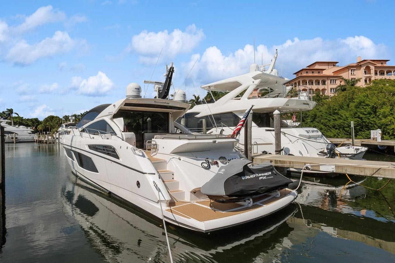 a boat docked at a pier aboard JOLLY ROGERS Yacht for Sale