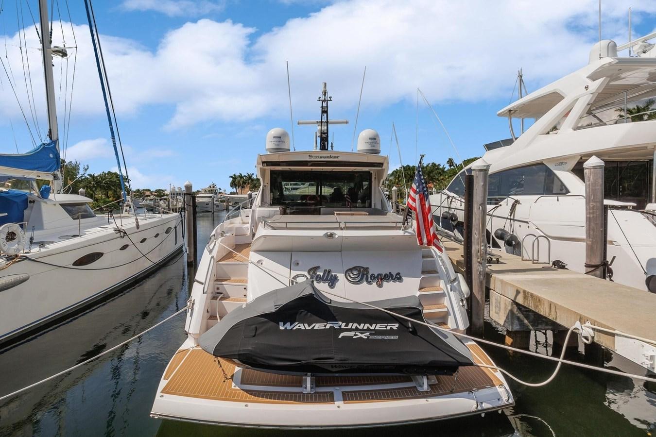 a boat is parked in a harbor aboard JOLLY ROGERS Yacht for Sale