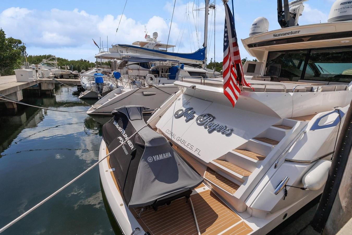 a boat with a flag on the front aboard JOLLY ROGERS Yacht for Sale