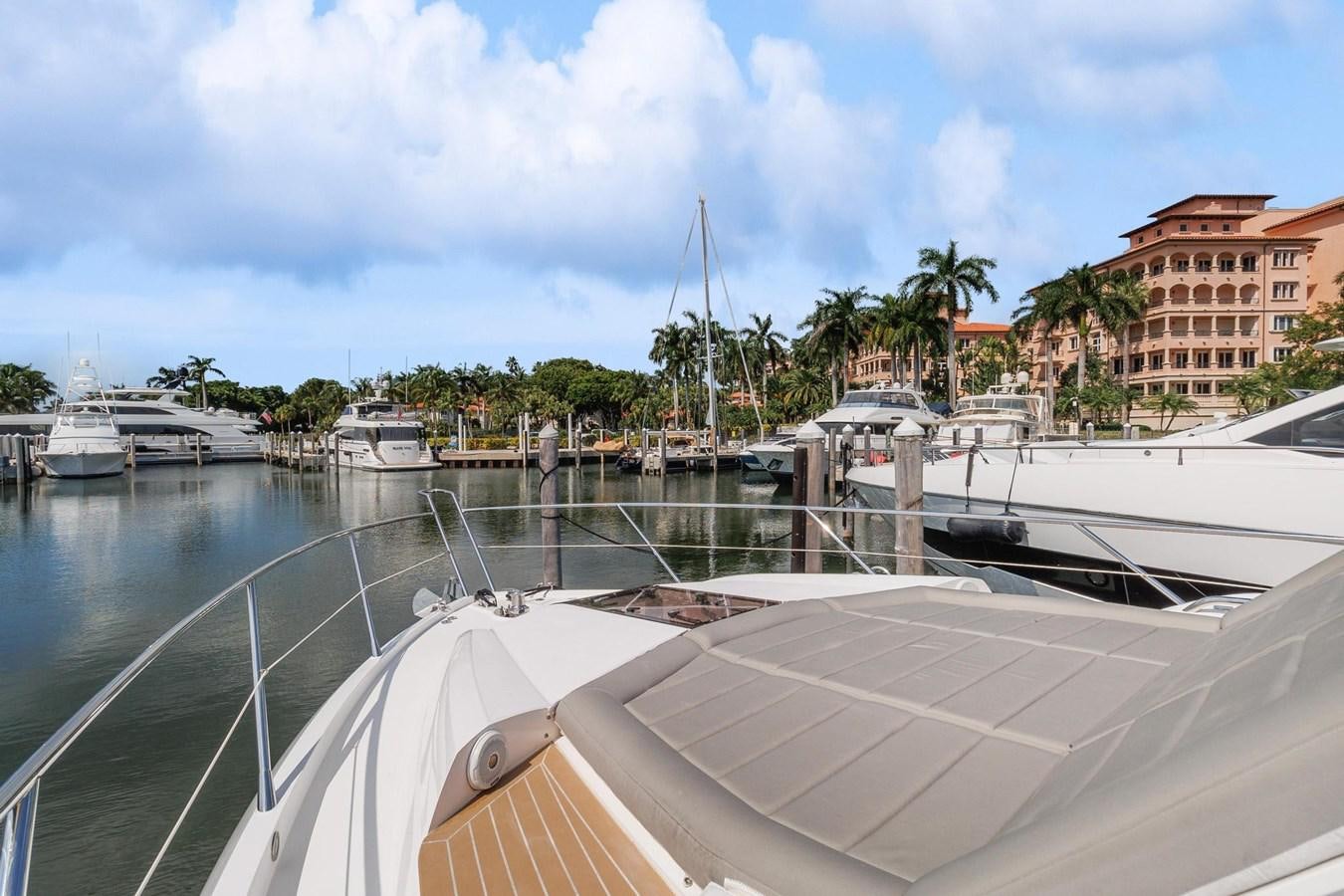 a boat is parked in a harbor aboard JOLLY ROGERS Yacht for Sale