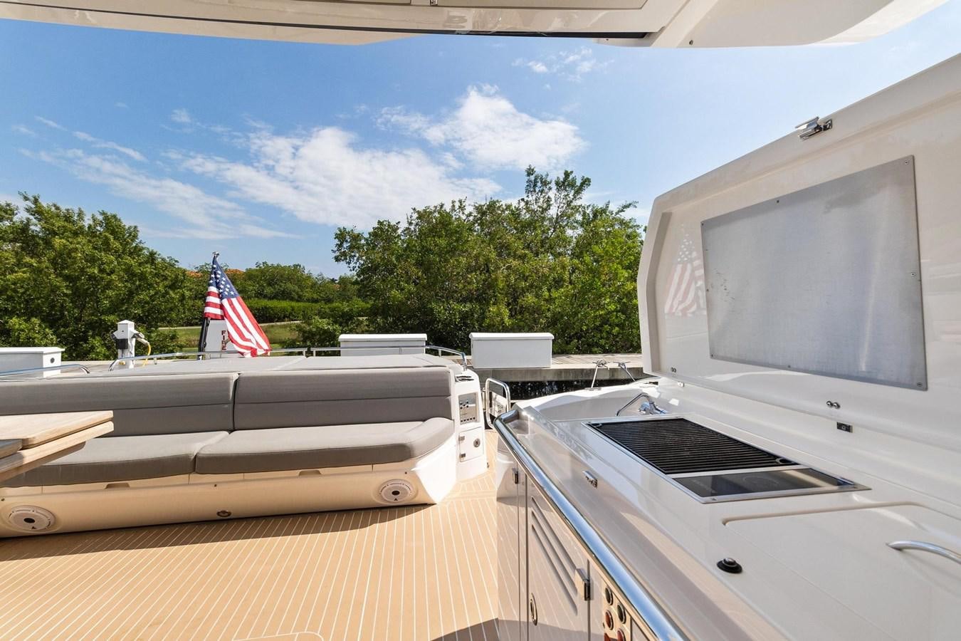 a deck with a flag on it aboard JOLLY ROGERS Yacht for Sale