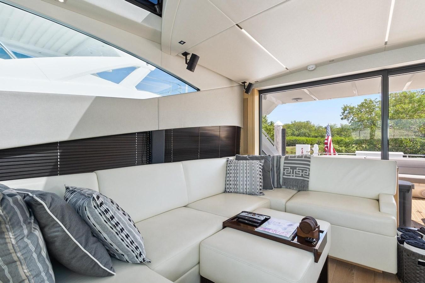 a living room with a large window aboard JOLLY ROGERS Yacht for Sale