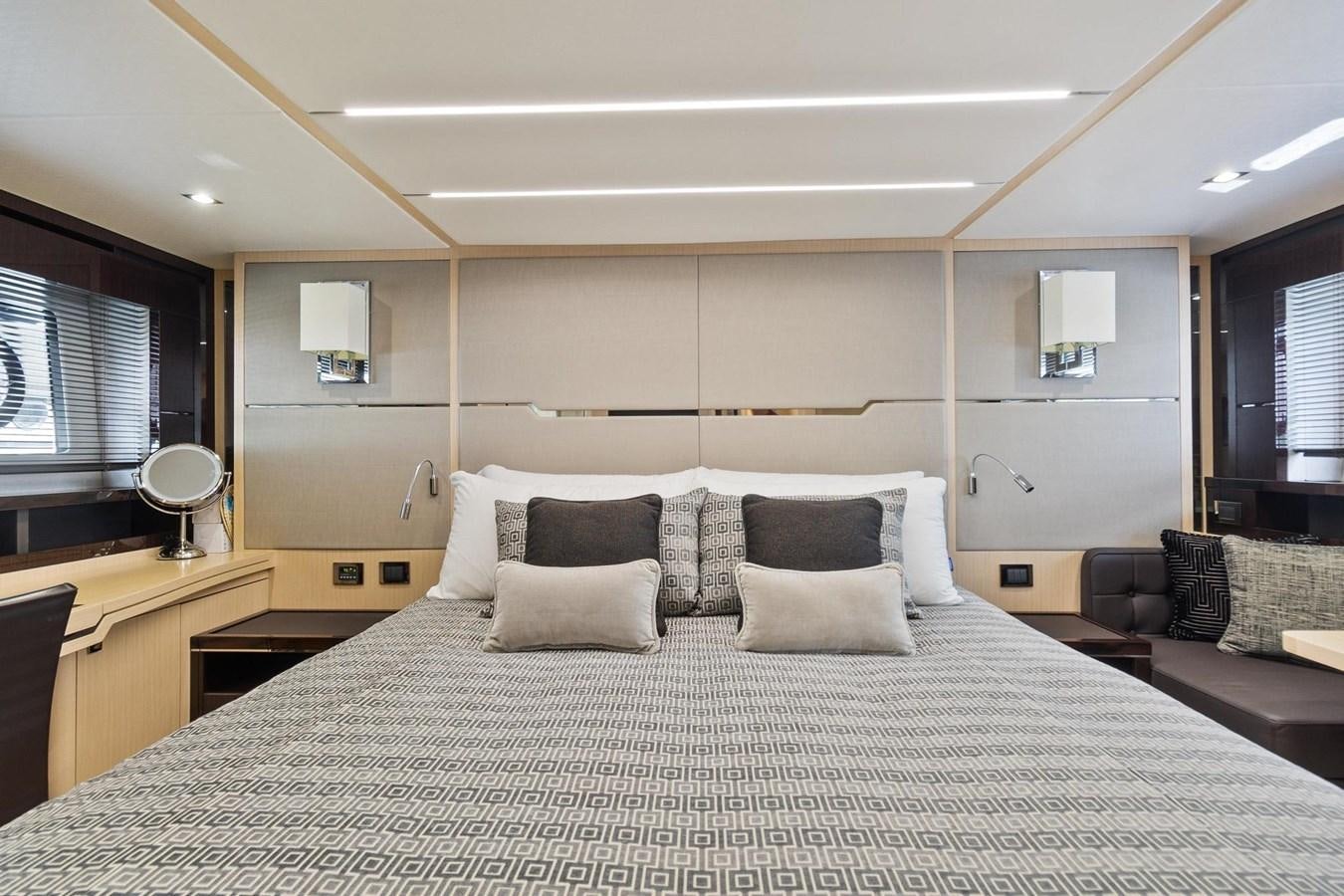 a large bed in a room aboard JOLLY ROGERS Yacht for Sale