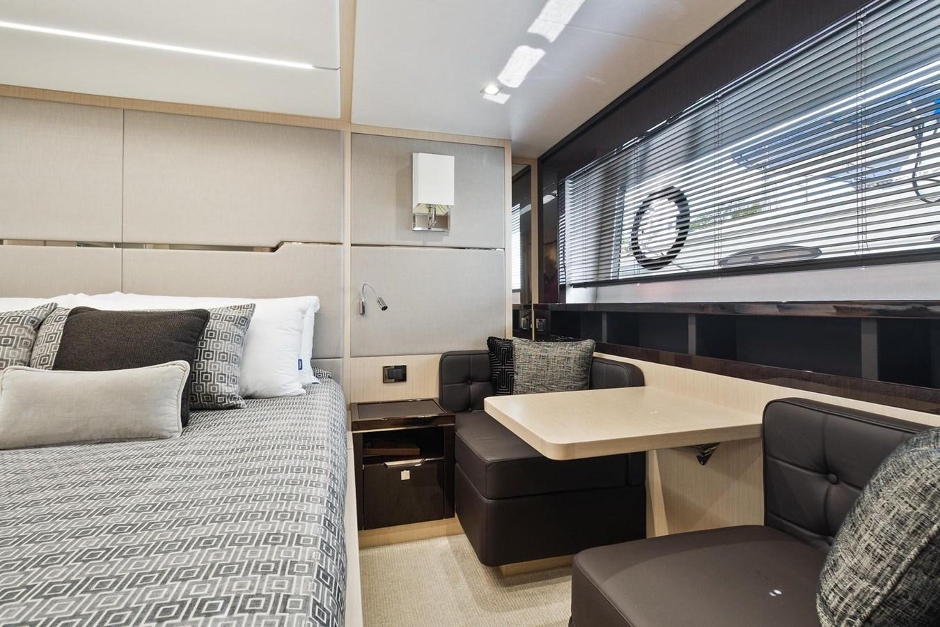 a room with a bed and a couch aboard JOLLY ROGERS Yacht for Sale