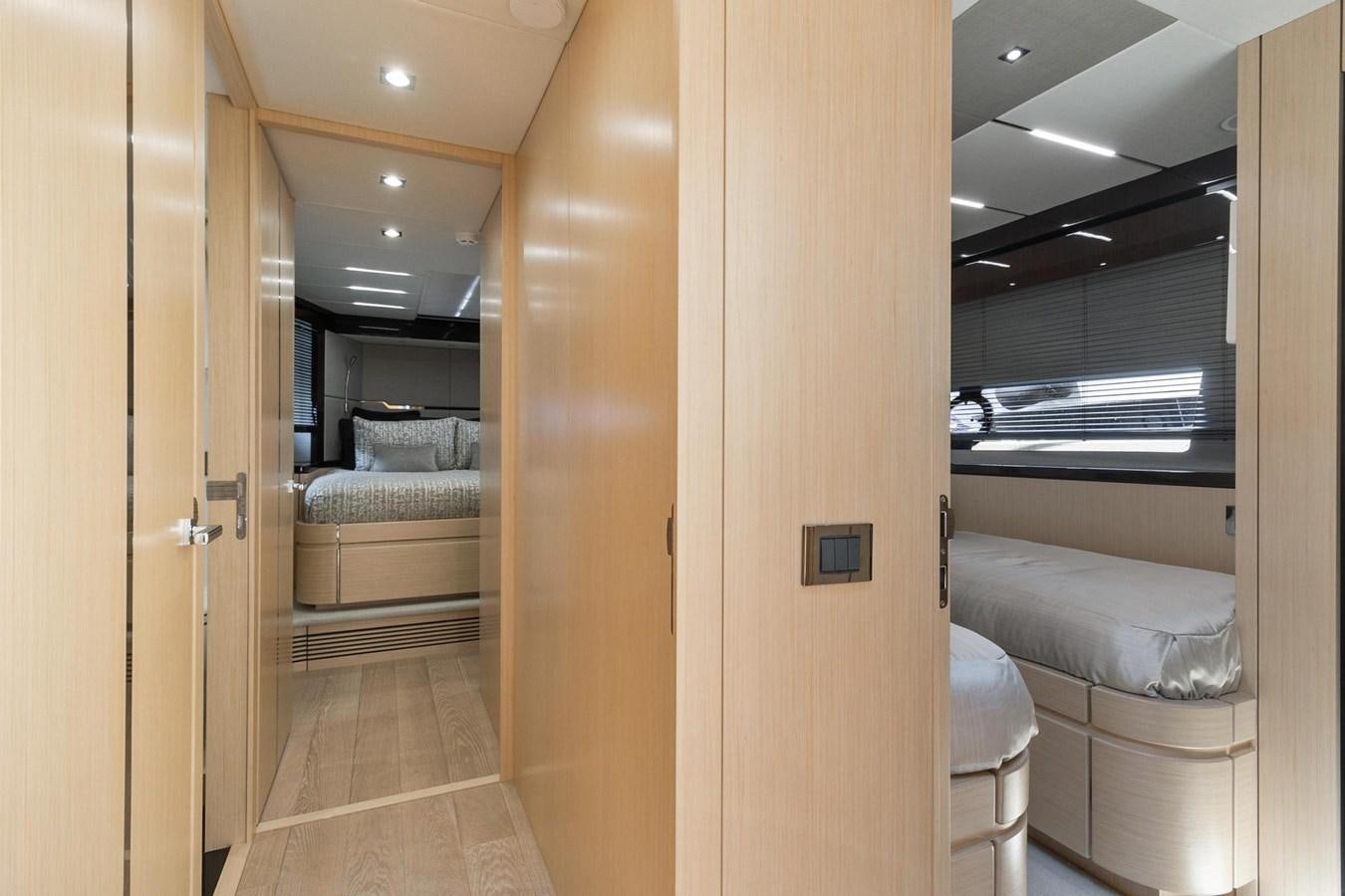 a room with a bed and a door aboard JOLLY ROGERS Yacht for Sale