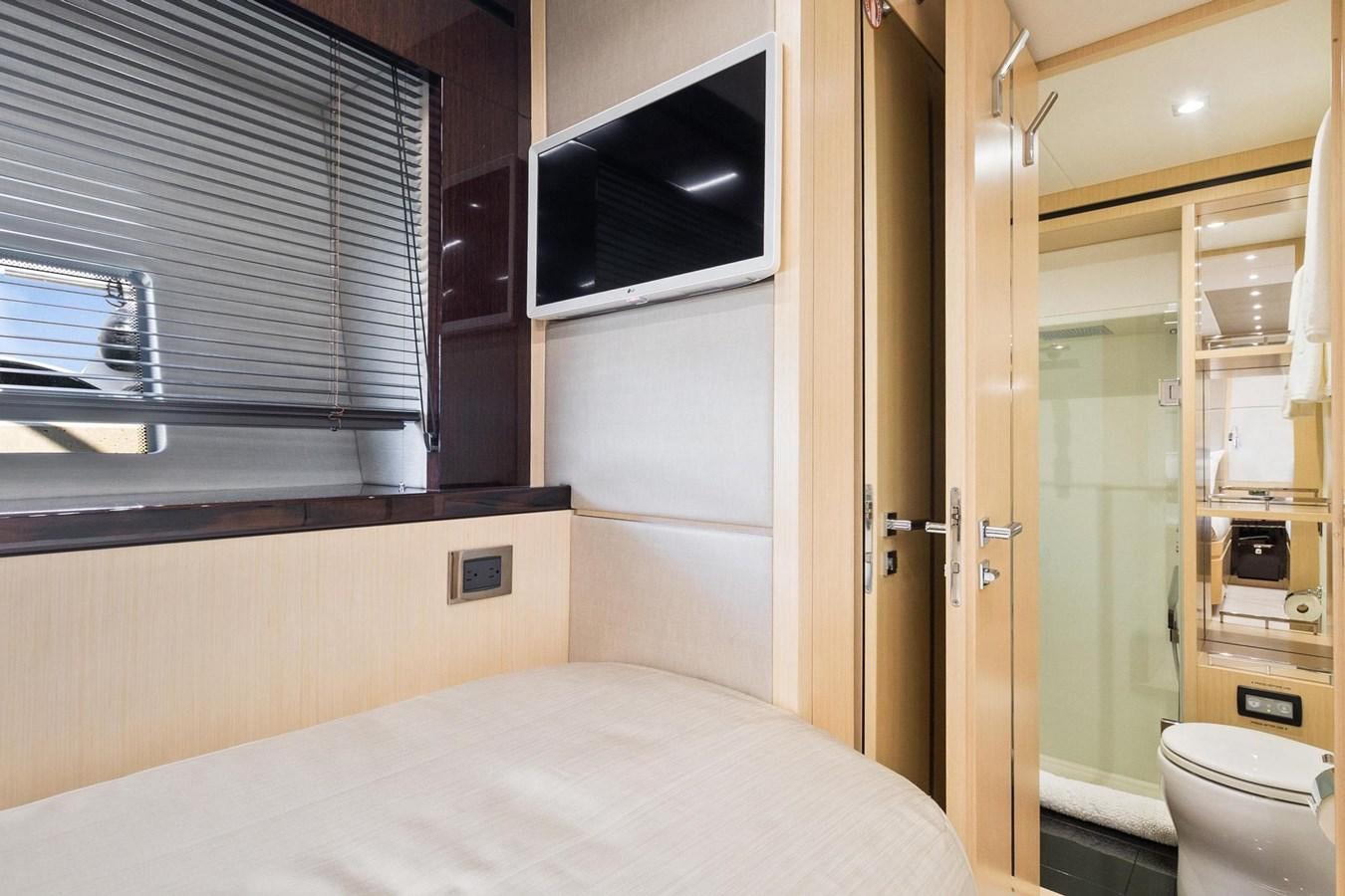 a room with a bed and a microwave aboard JOLLY ROGERS Yacht for Sale