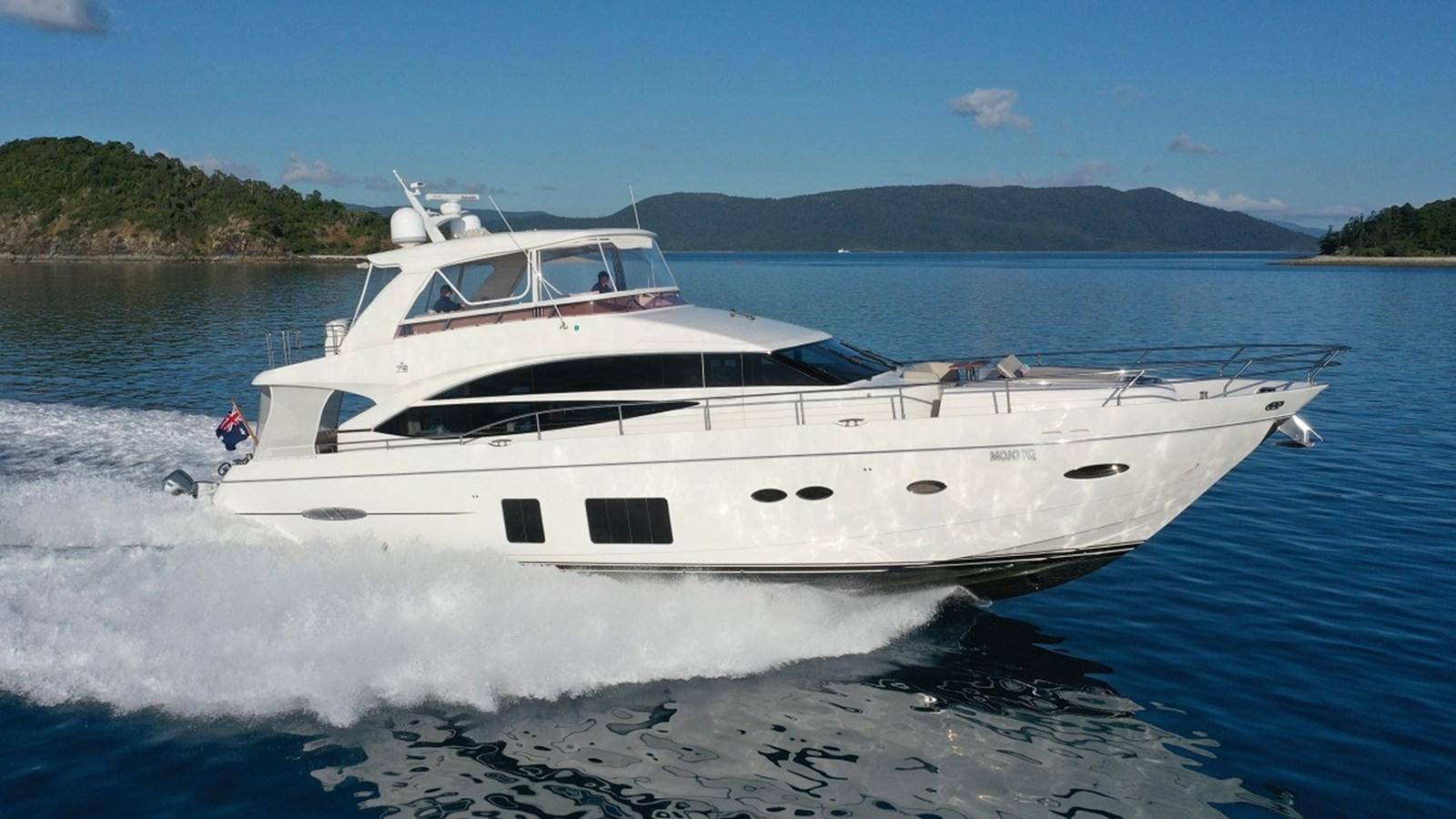 a white yacht on the water aboard MOJO Yacht for Sale