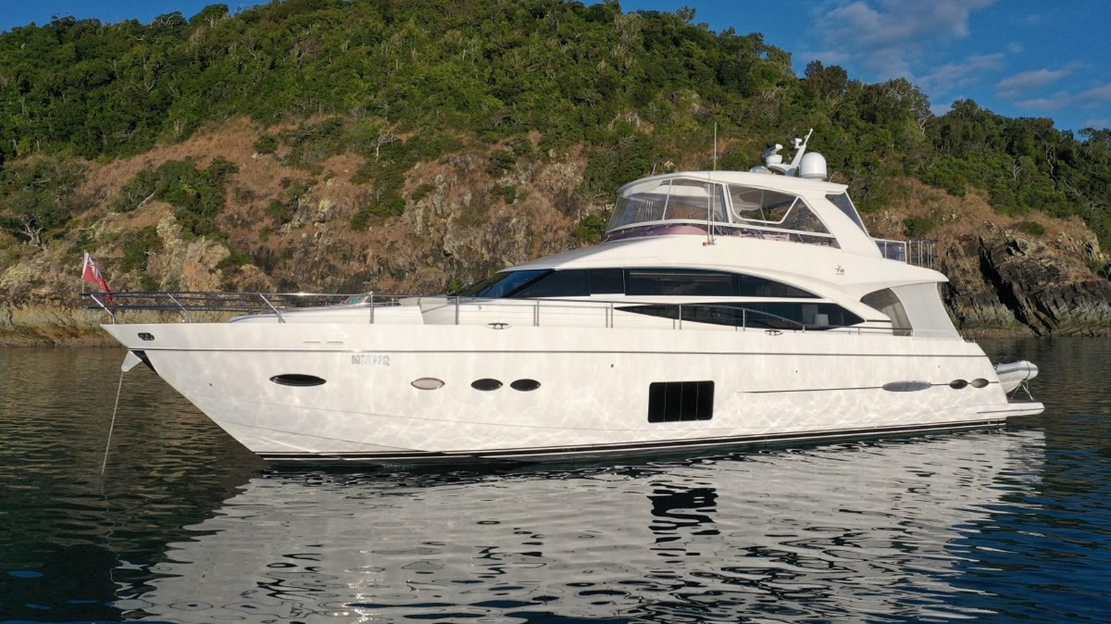a white yacht in the water aboard MOJO Yacht for Sale