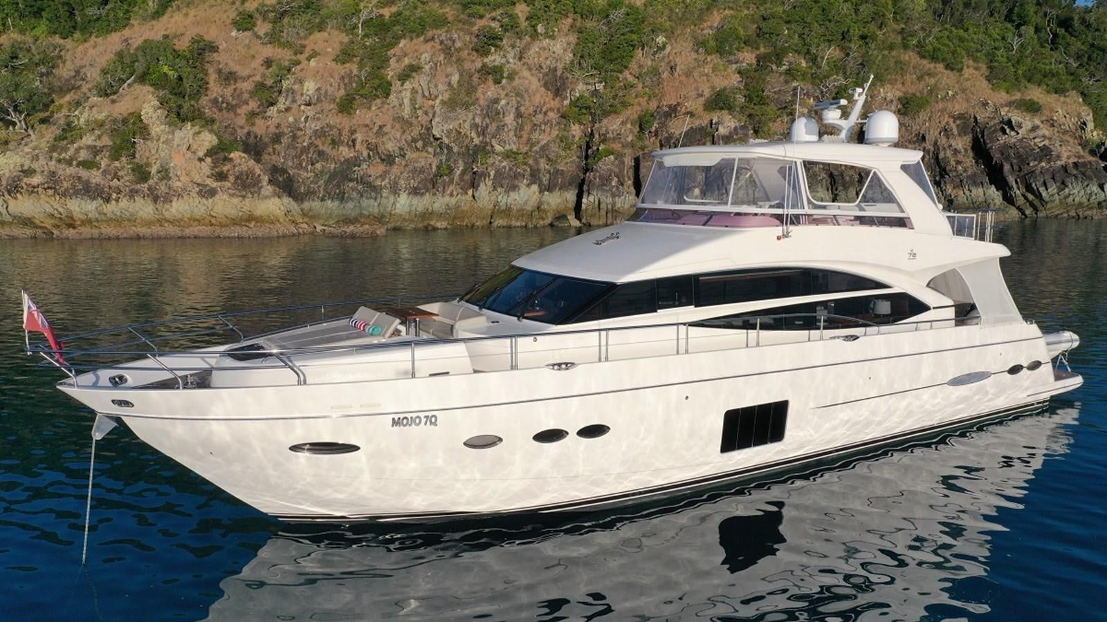 a white yacht on the water aboard MOJO Yacht for Sale