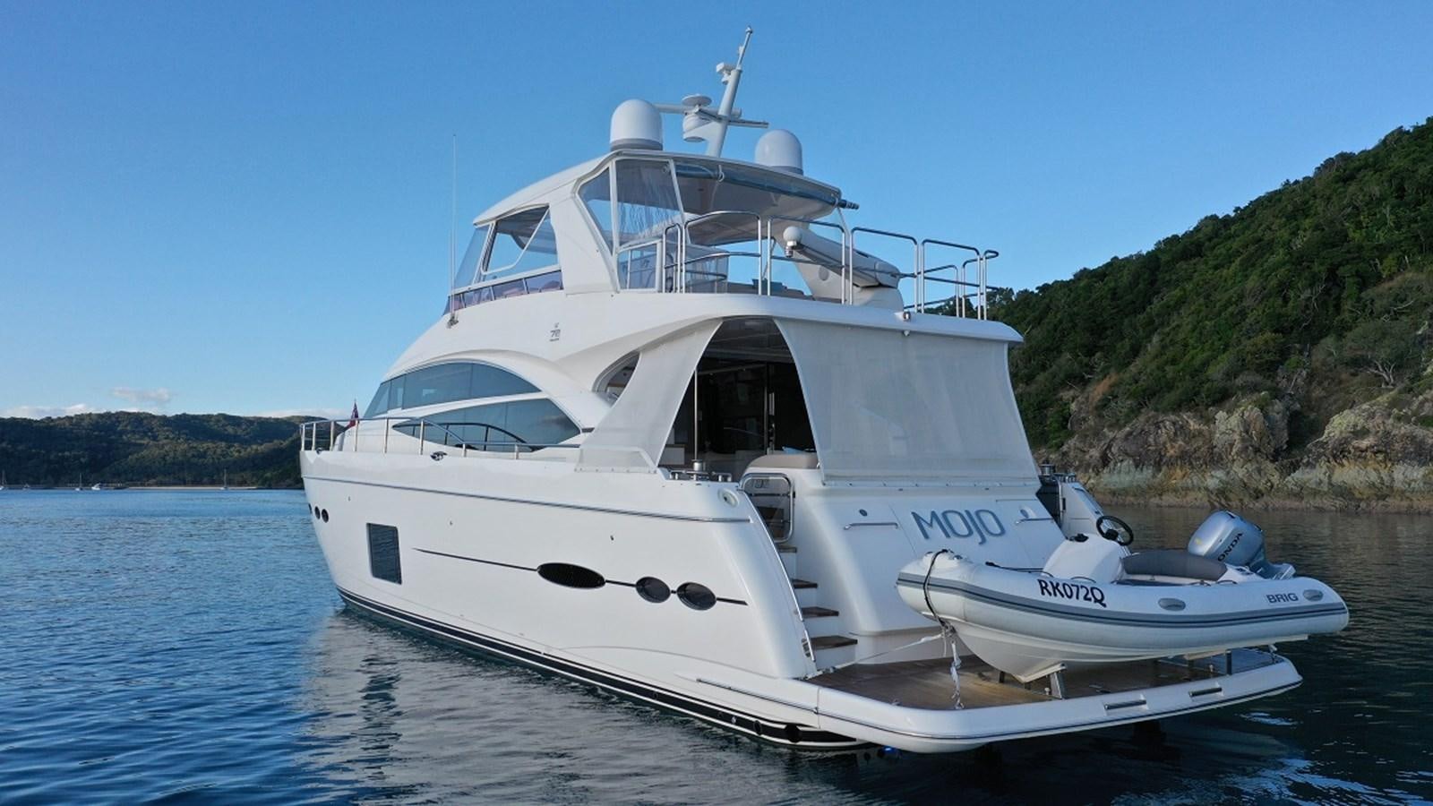 a white boat on water aboard MOJO Yacht for Sale