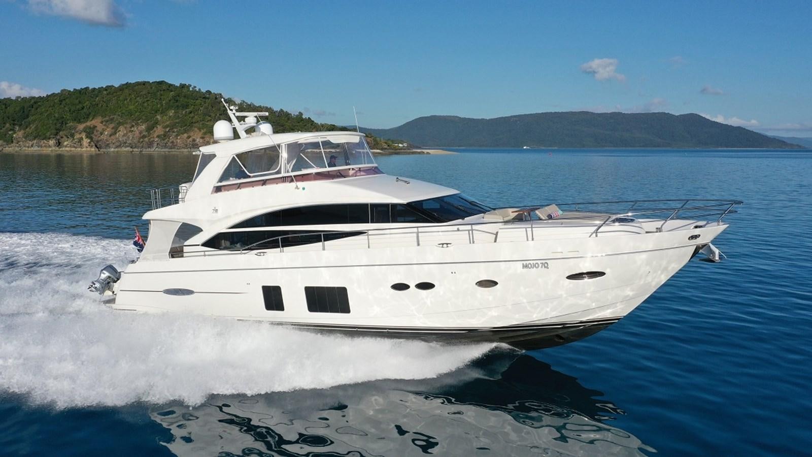 a white yacht on the water aboard MOJO Yacht for Sale