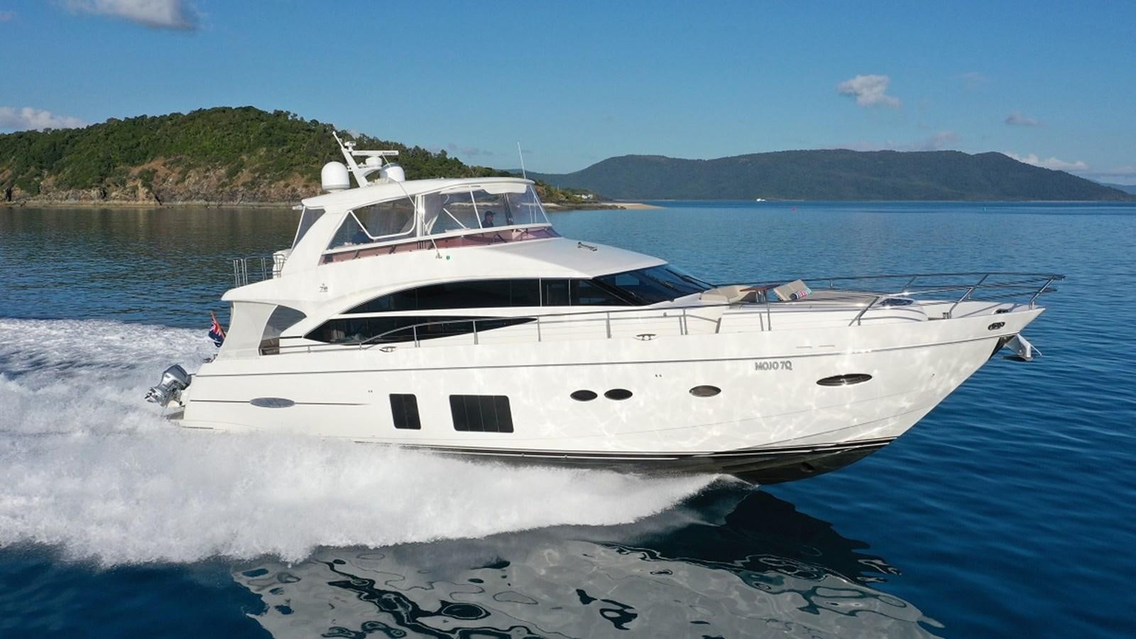 a white yacht on the water aboard MOJO Yacht for Sale