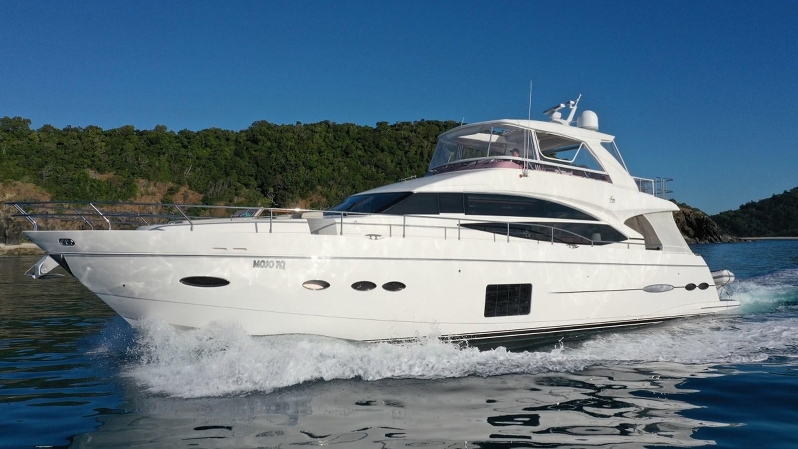 a white yacht on the water aboard MOJO Yacht for Sale