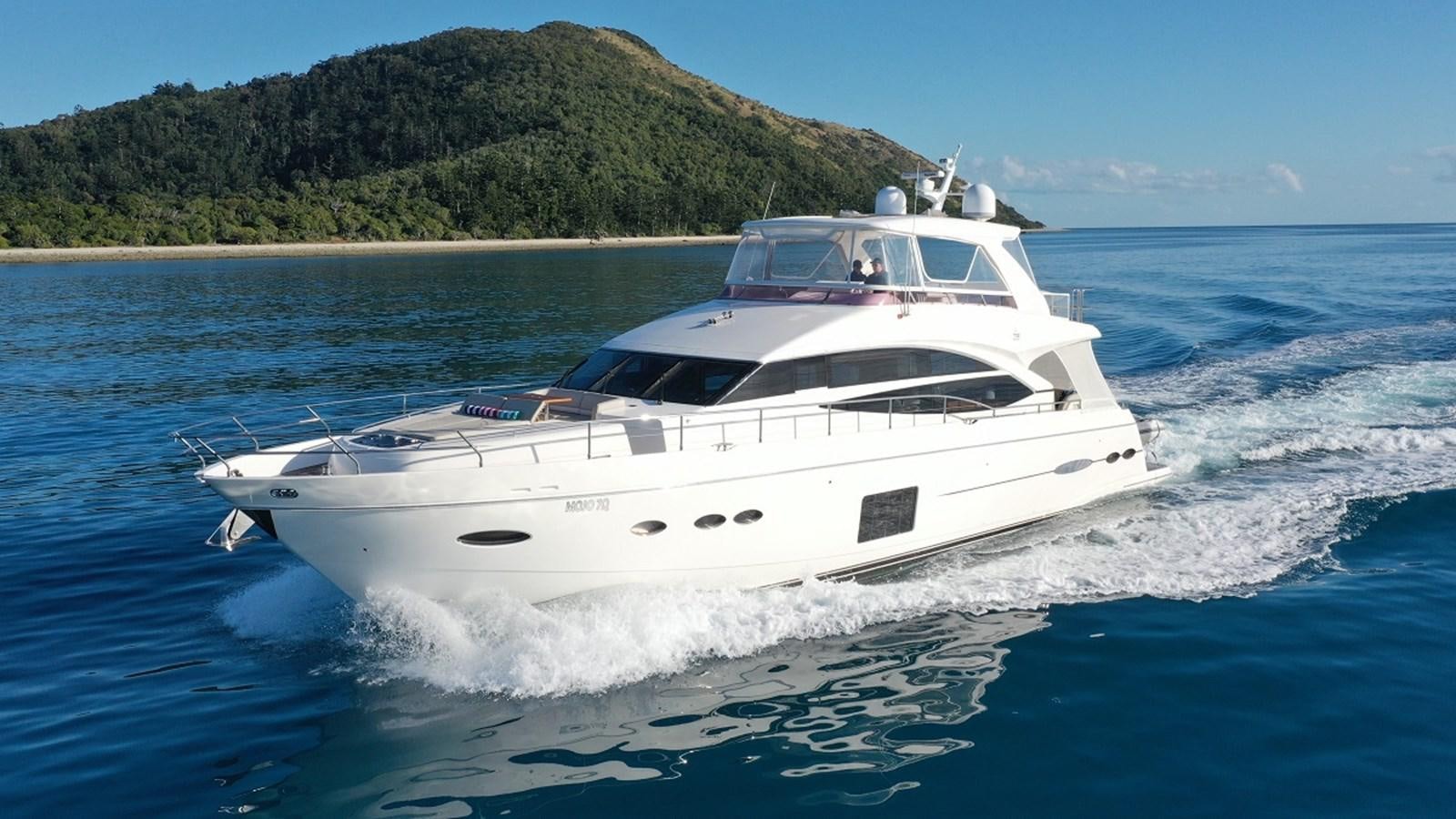a white yacht on the water aboard MOJO Yacht for Sale