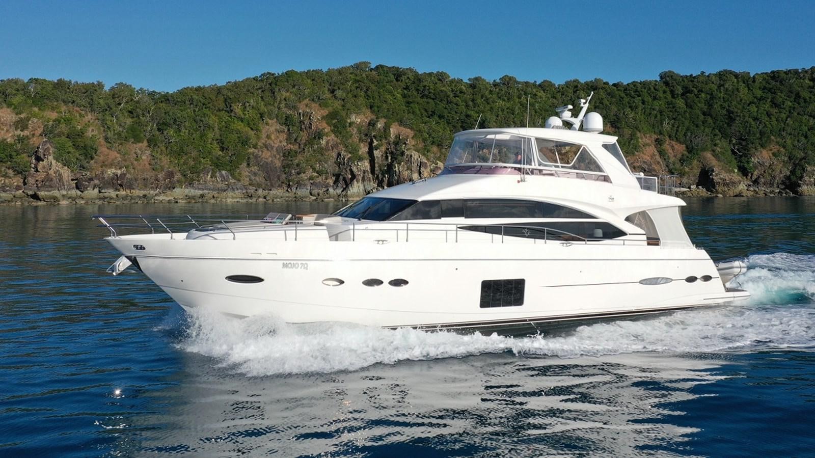 a white yacht on the water aboard MOJO Yacht for Sale