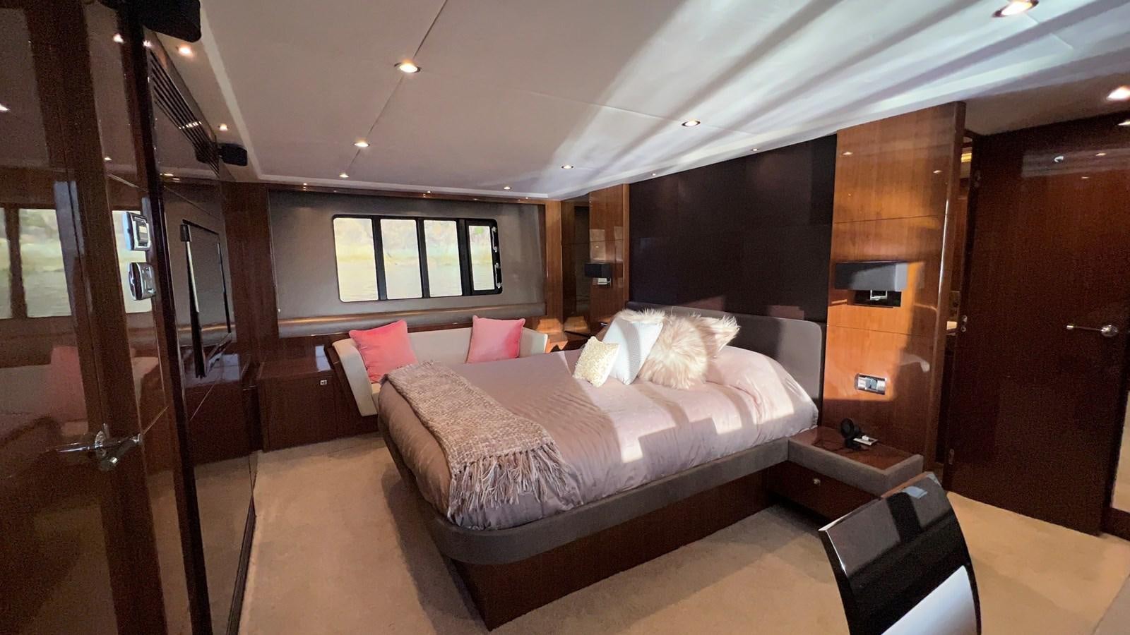 a room with a bed and a window aboard MOJO Yacht for Sale