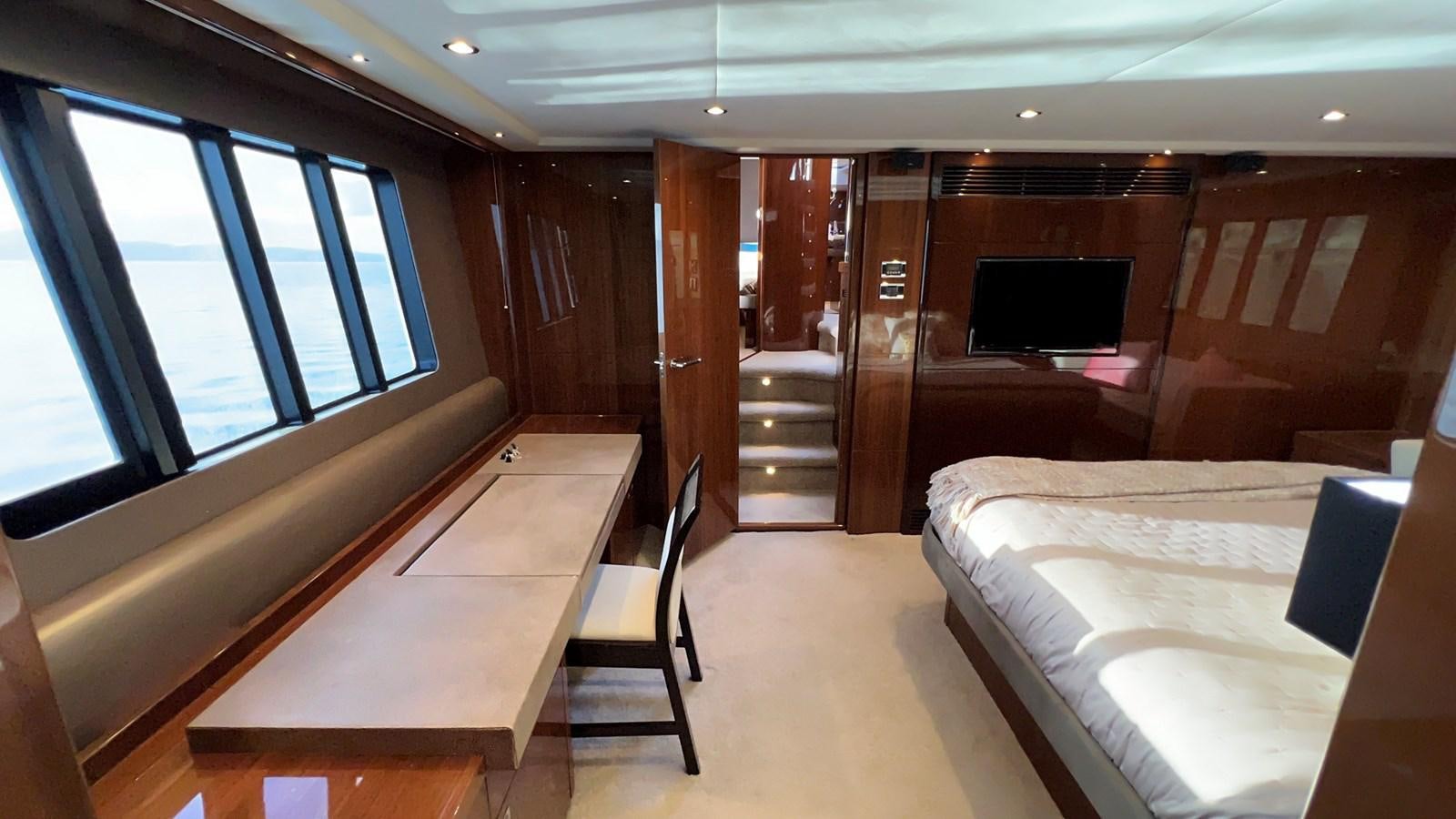 a room with a bed and a tv aboard MOJO Yacht for Sale