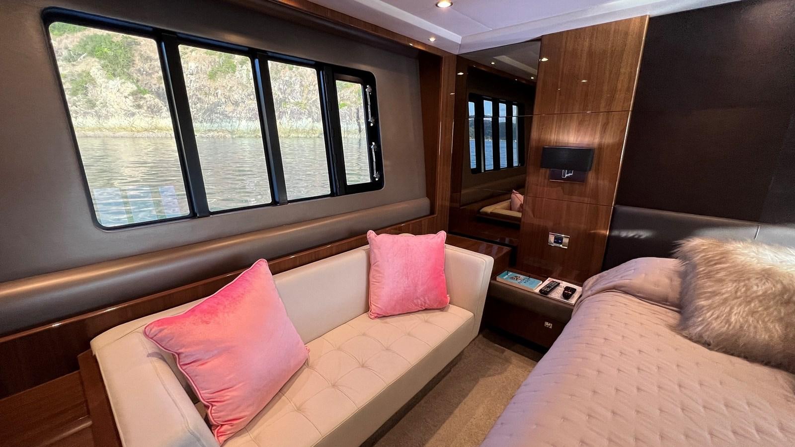 a room with a bed and a window aboard MOJO Yacht for Sale