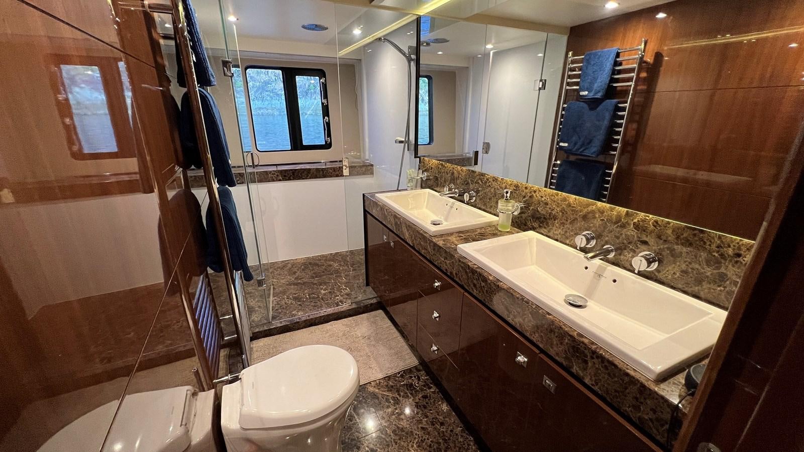 a bathroom with a large countertop aboard MOJO Yacht for Sale
