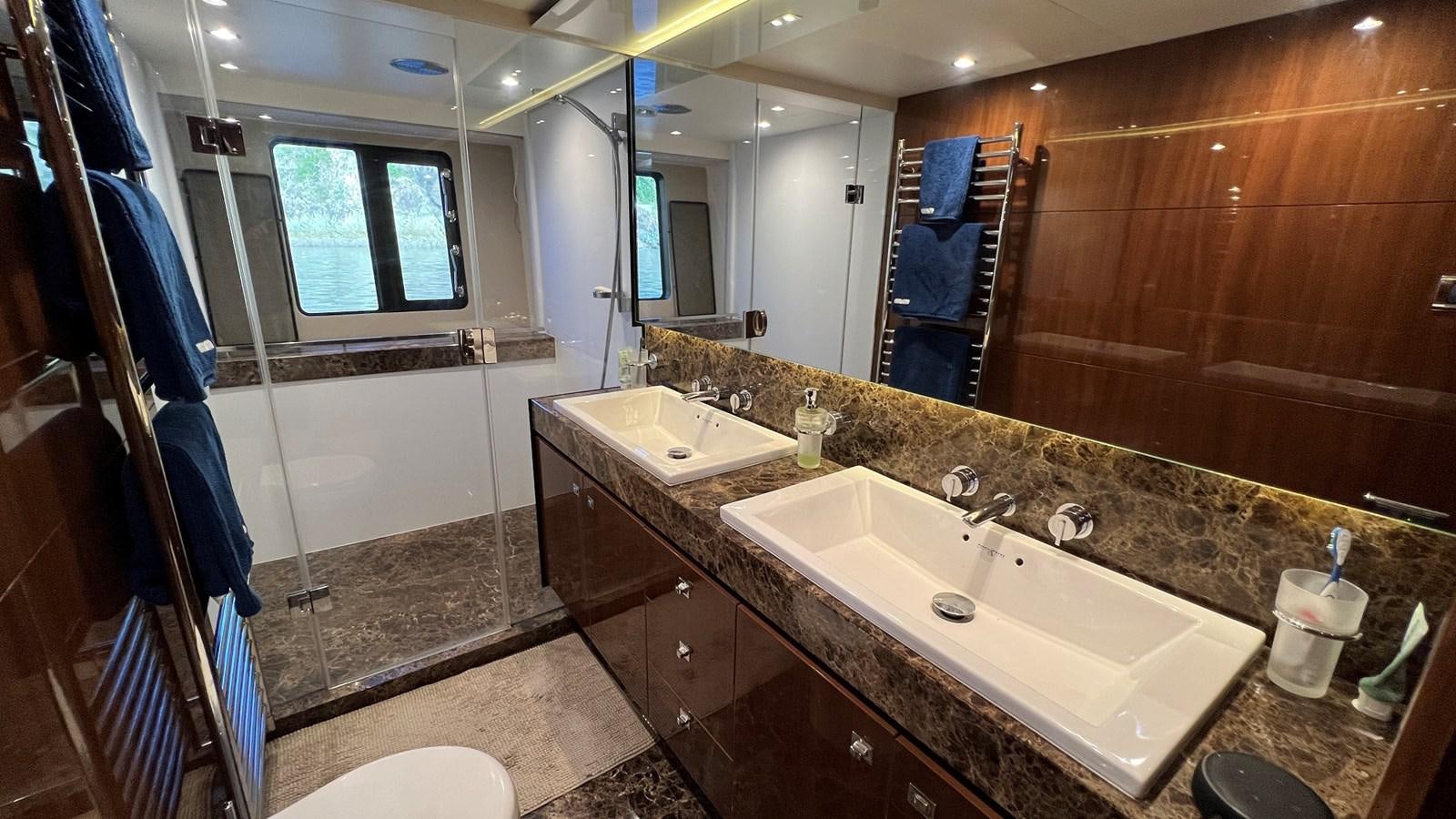 a bathroom with a large countertop aboard MOJO Yacht for Sale