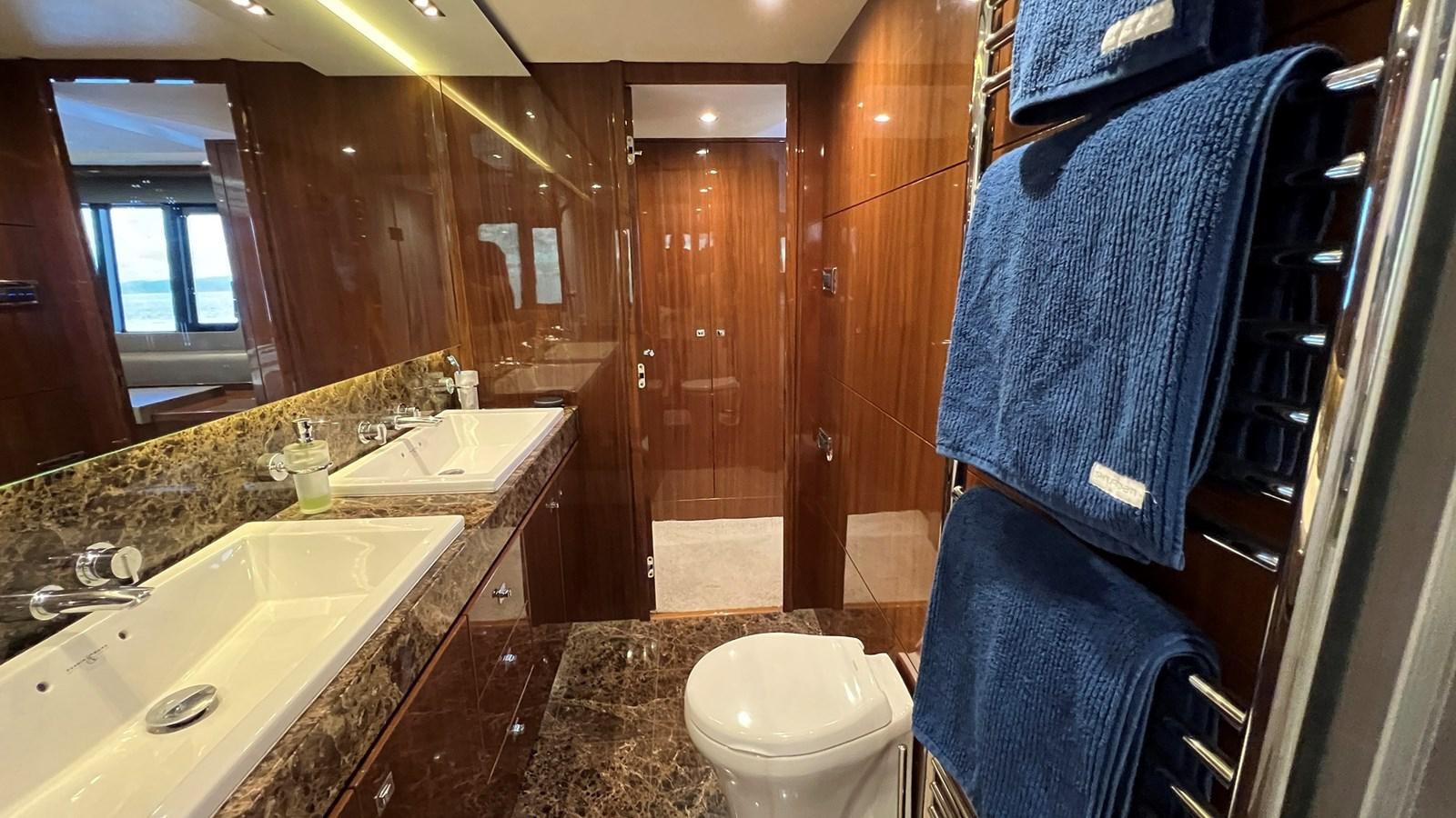 a bathroom with a towel over the sink aboard MOJO Yacht for Sale