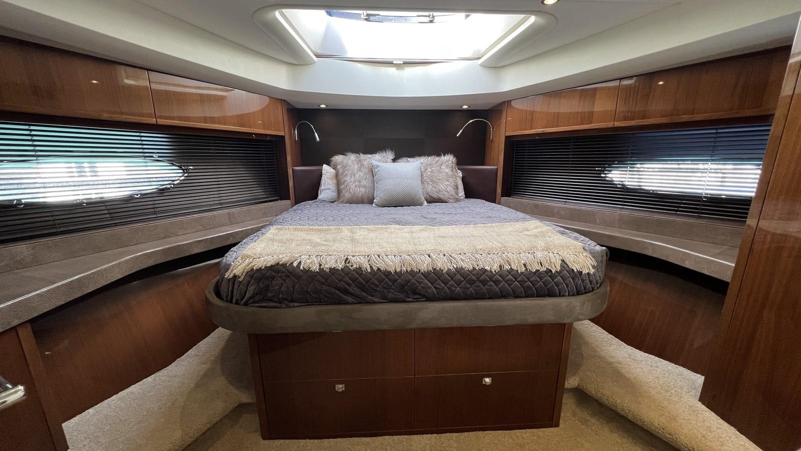 a bed in a room aboard MOJO Yacht for Sale