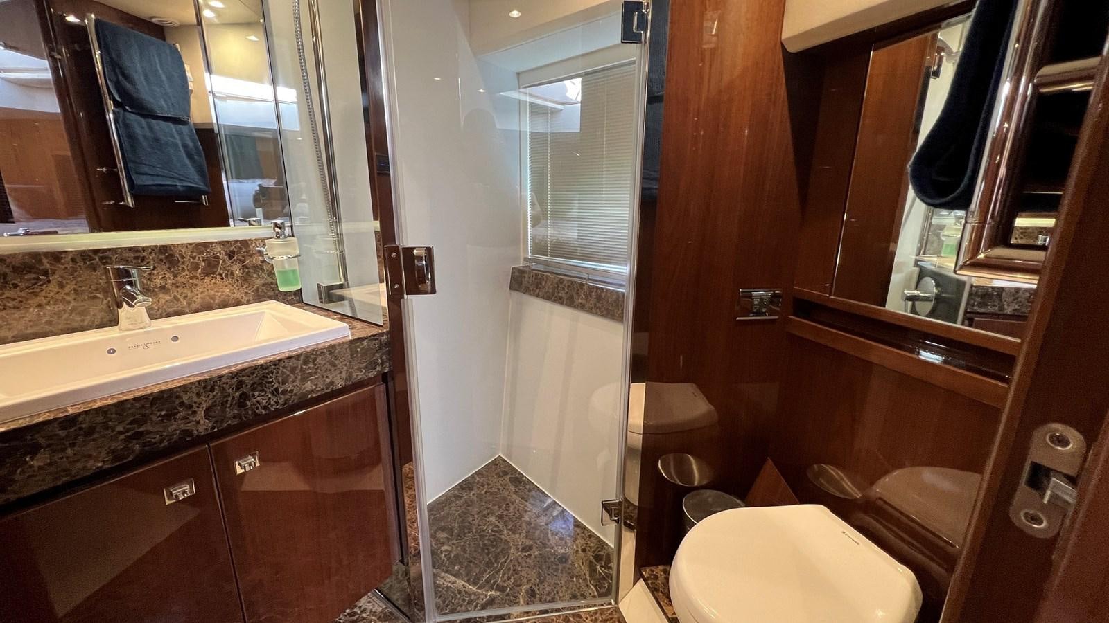 a bathroom with a sink and a toilet aboard MOJO Yacht for Sale