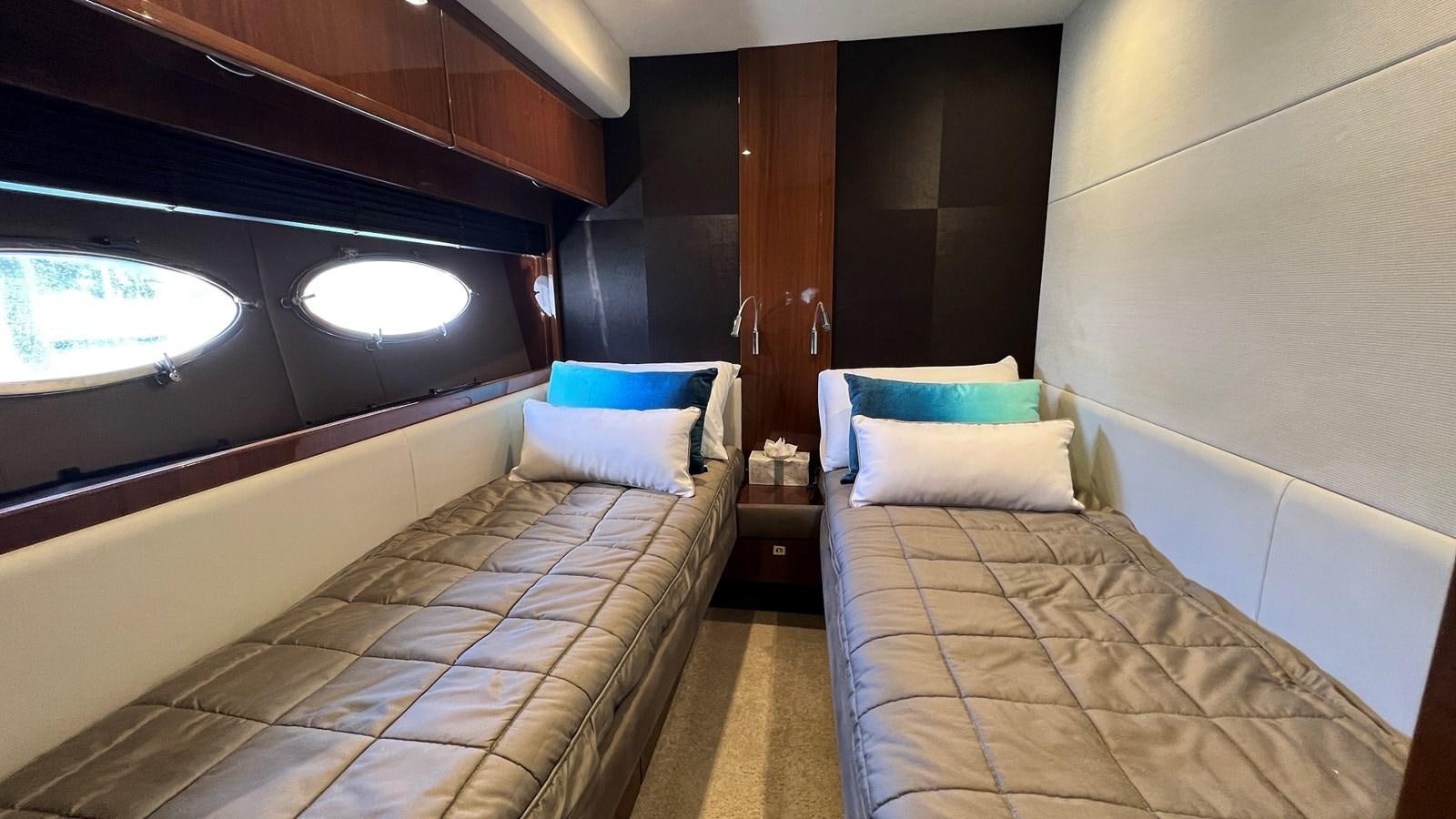 a room with two beds aboard MOJO Yacht for Sale