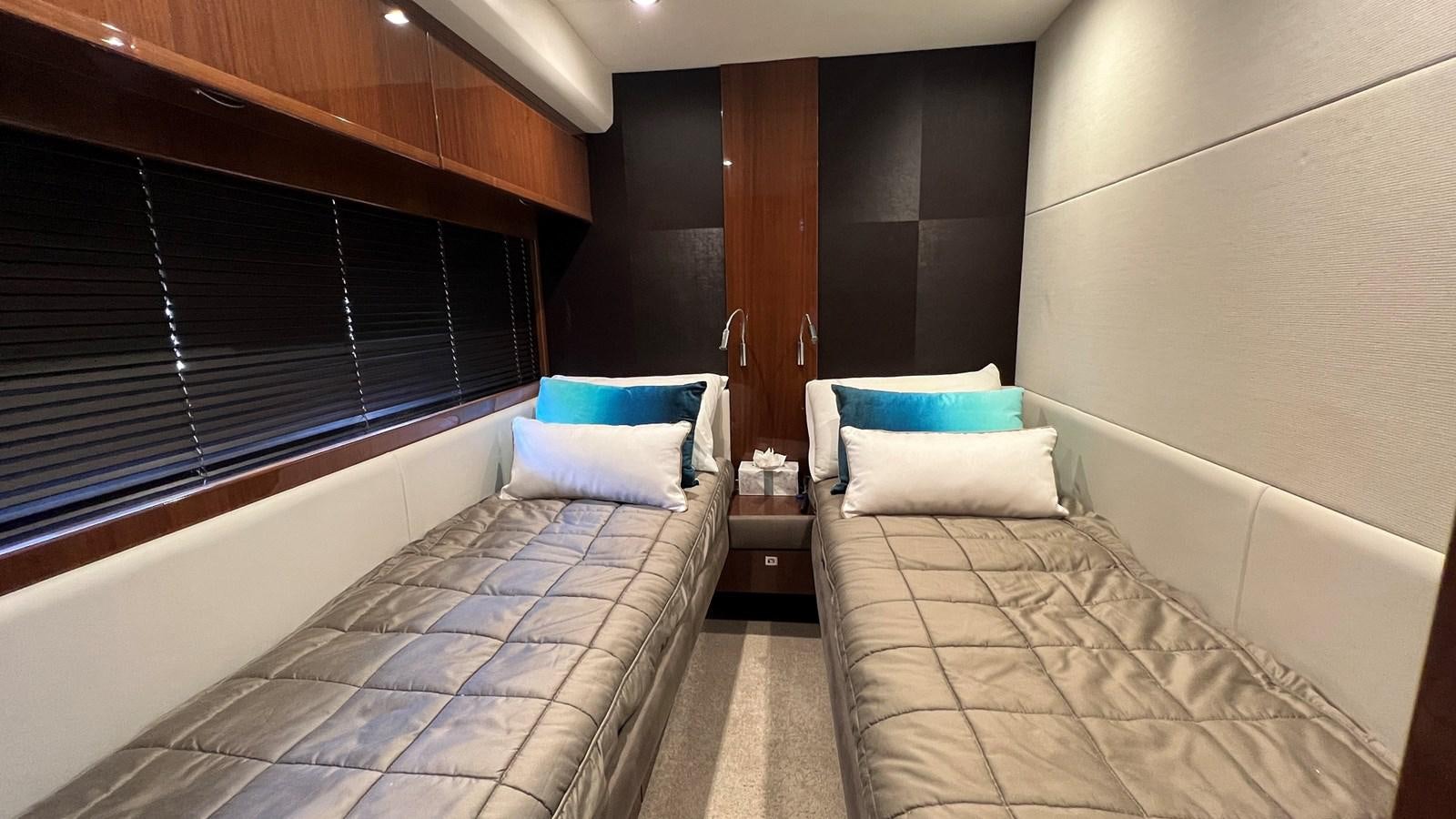 a room with two beds aboard MOJO Yacht for Sale