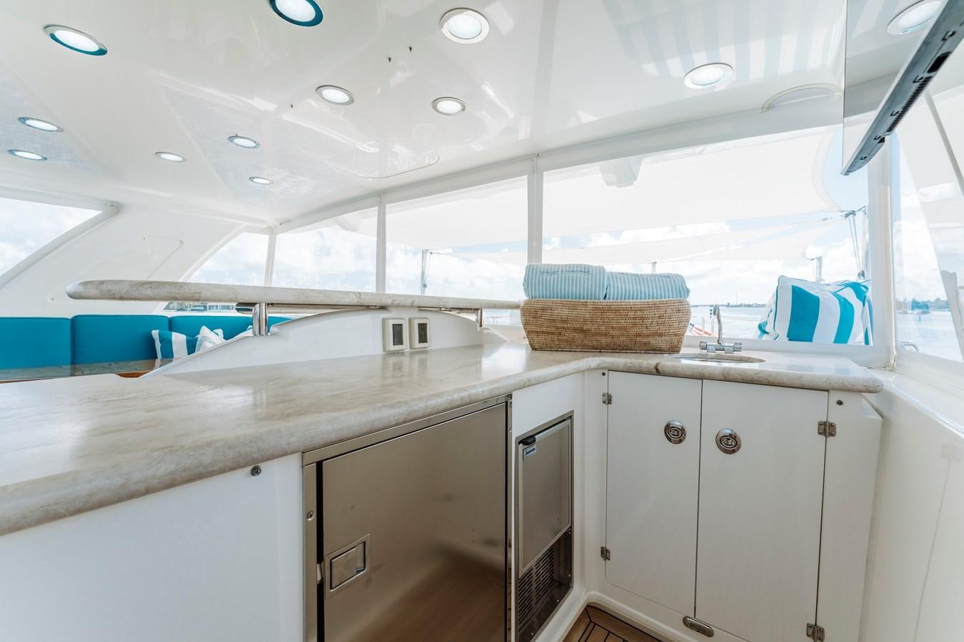 a kitchen with white cabinets aboard FULLY OCCUPIED Yacht for Sale