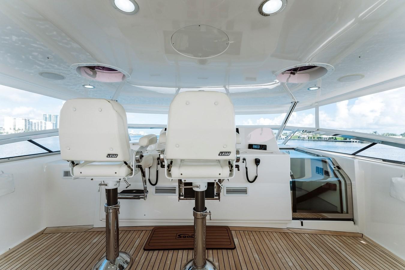 a white machine on a wooden platform aboard FULLY OCCUPIED Yacht for Sale