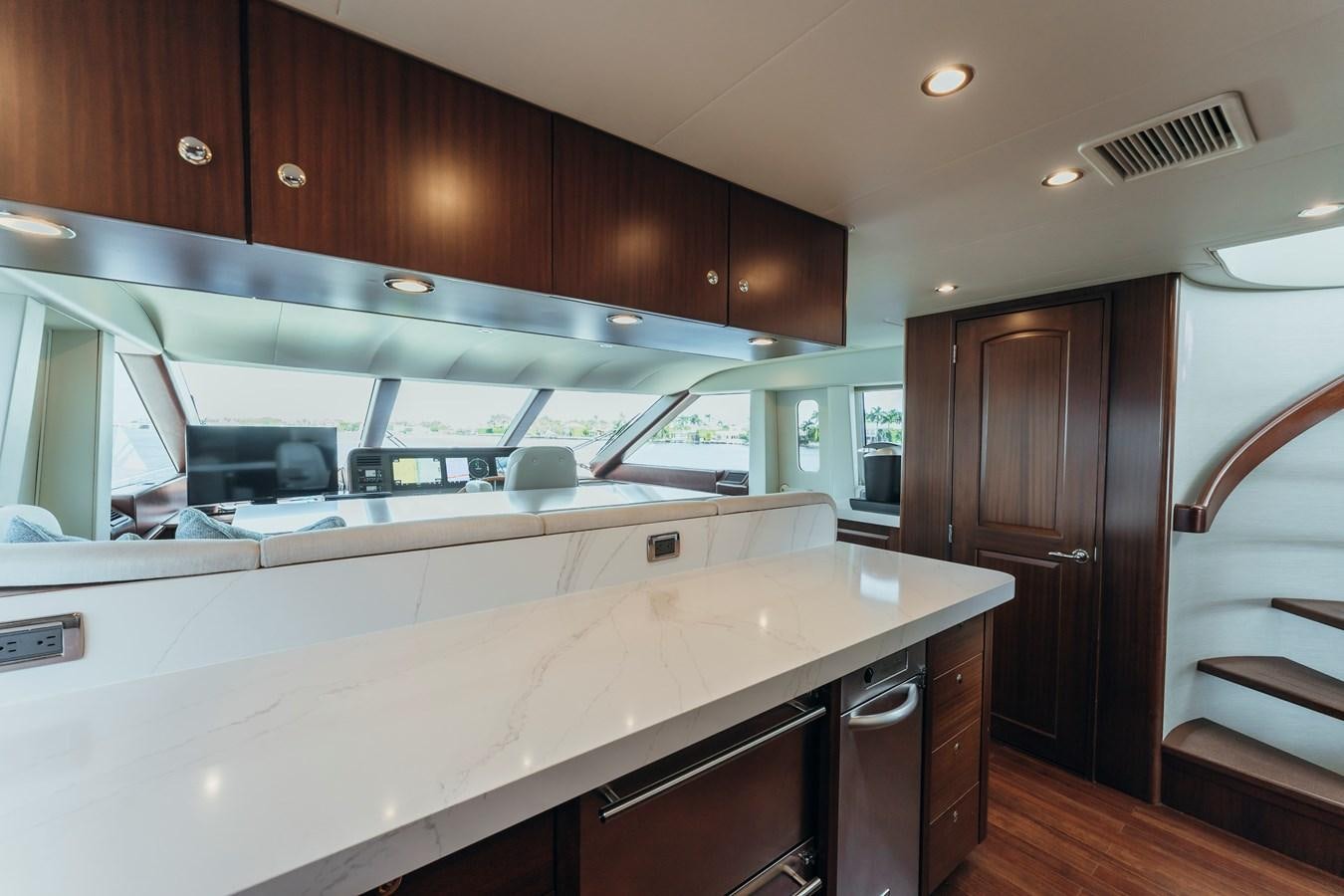 a kitchen with a large island aboard FULLY OCCUPIED Yacht for Sale