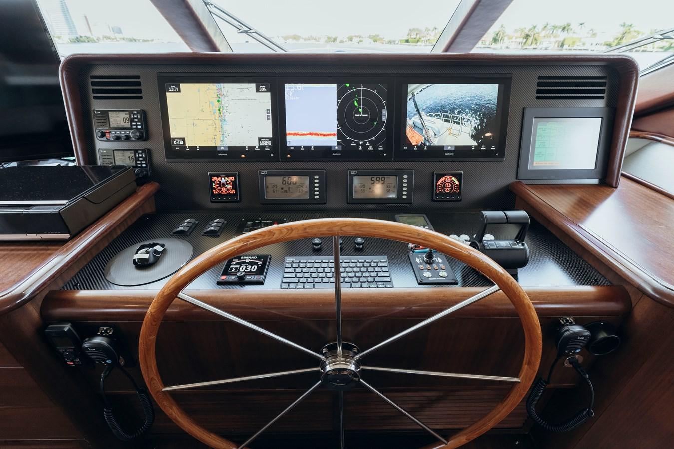 a radio on a table aboard FULLY OCCUPIED Yacht for Sale