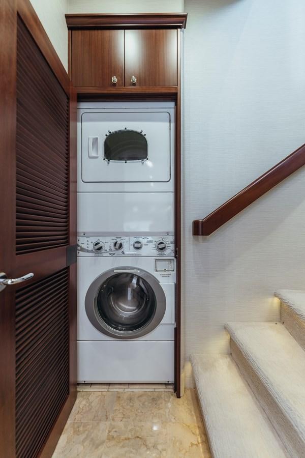 a washer and dryer in a room aboard FULLY OCCUPIED Yacht for Sale