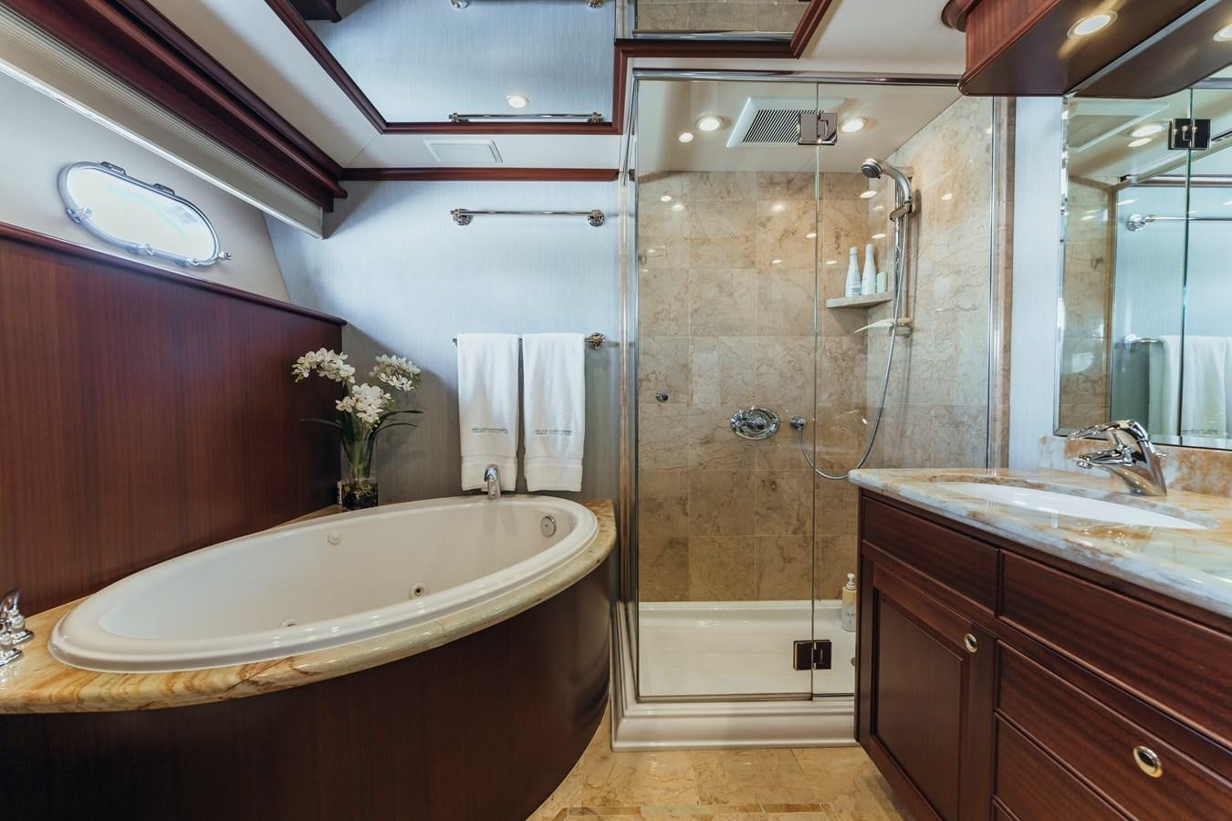 a bathroom with a bathtub and shower aboard FULLY OCCUPIED Yacht for Sale