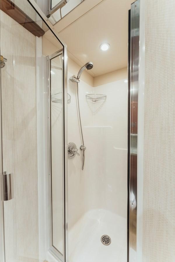 a shower with a glass door aboard FULLY OCCUPIED Yacht for Sale
