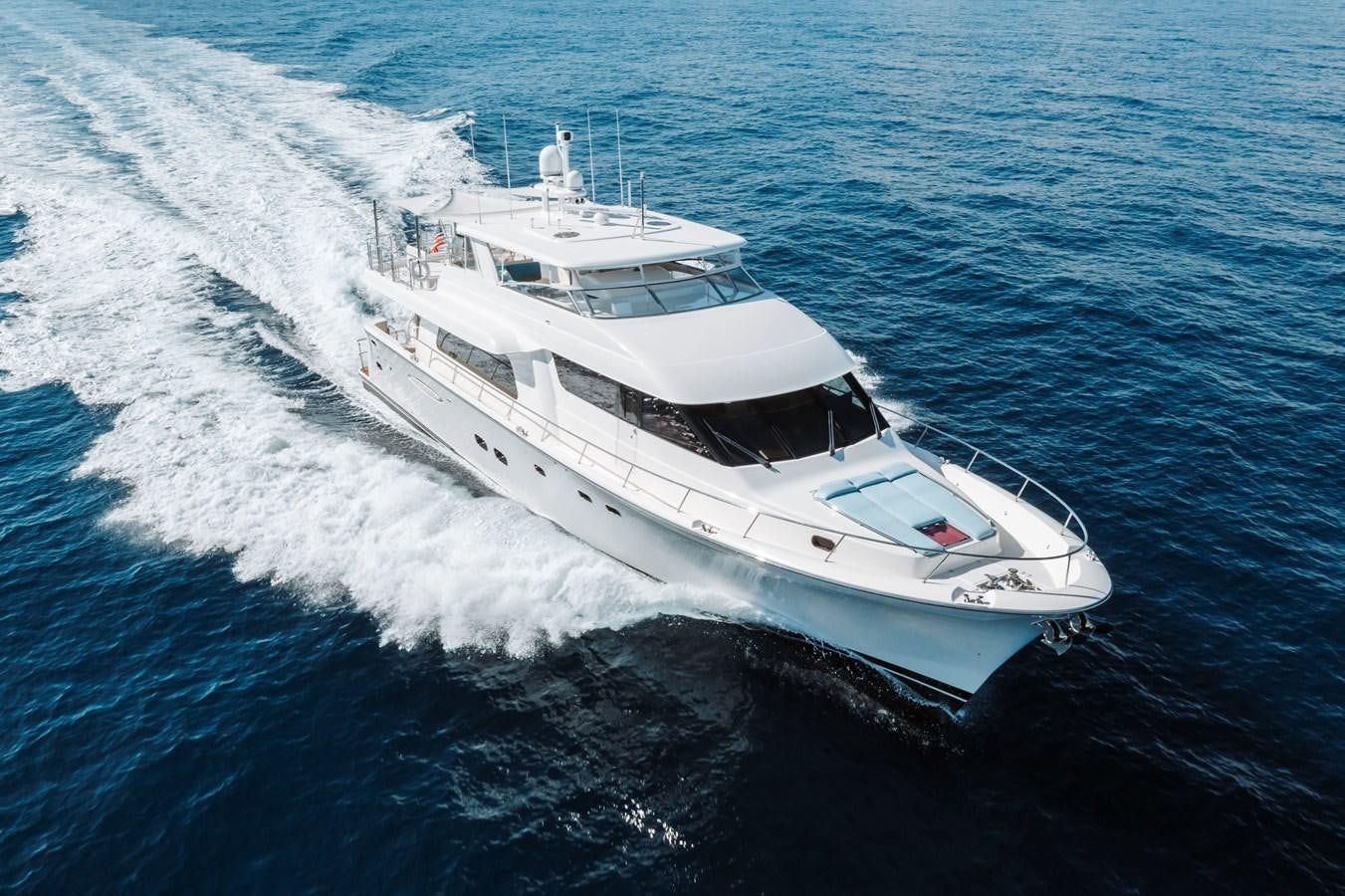 a white yacht on the water aboard FULLY OCCUPIED Yacht for Sale