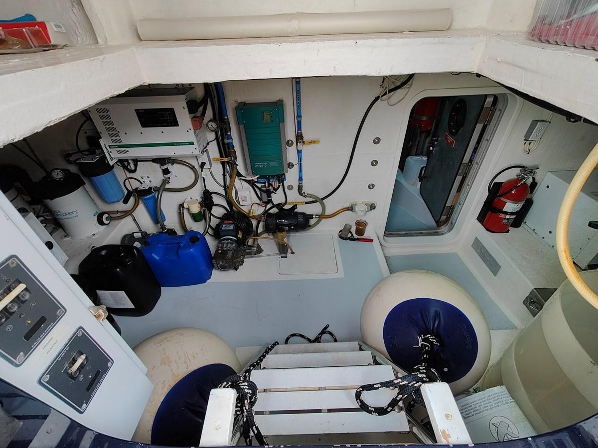 a white vehicle with a blue circle aboard SPELLBOUND Yacht for Sale