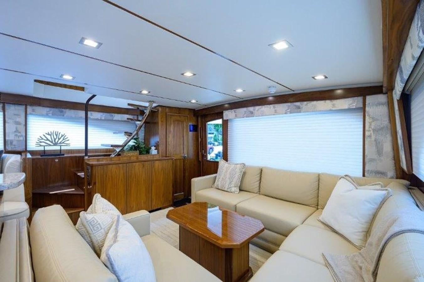 a living room with a large window aboard 50 CALIBER Yacht for Sale