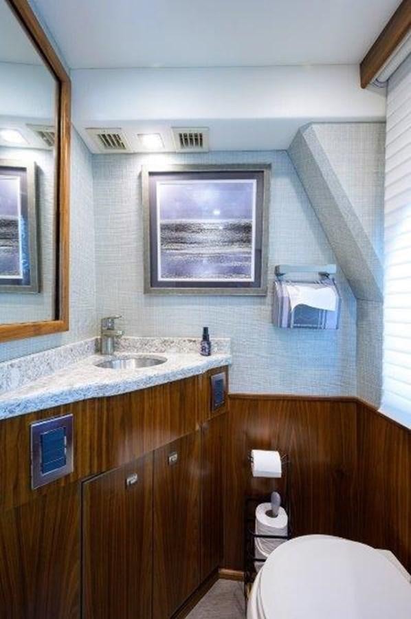 a bathroom with a sink and a toilet aboard 50 CALIBER Yacht for Sale