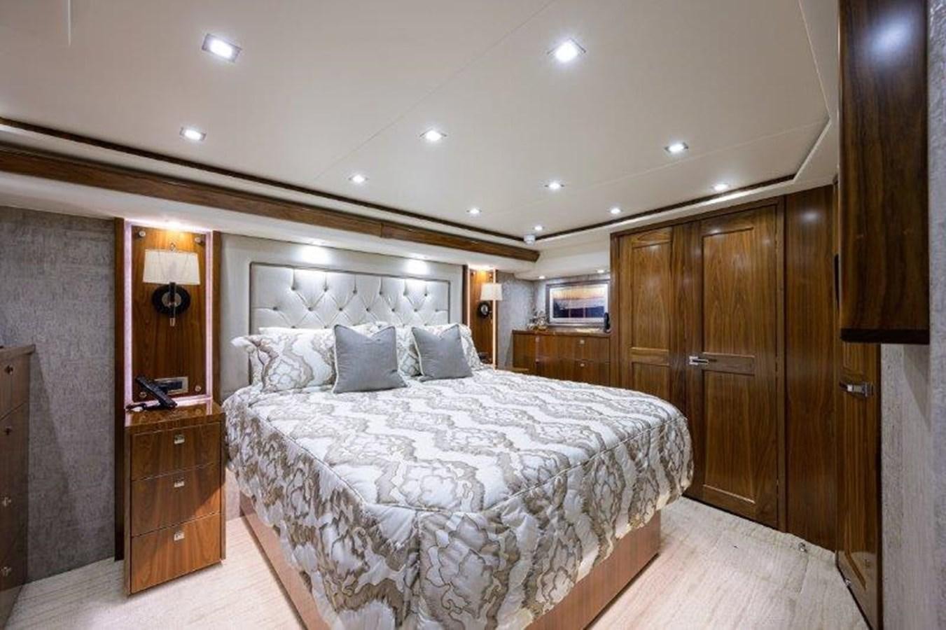 a large bedroom with a large bed aboard 50 CALIBER Yacht for Sale