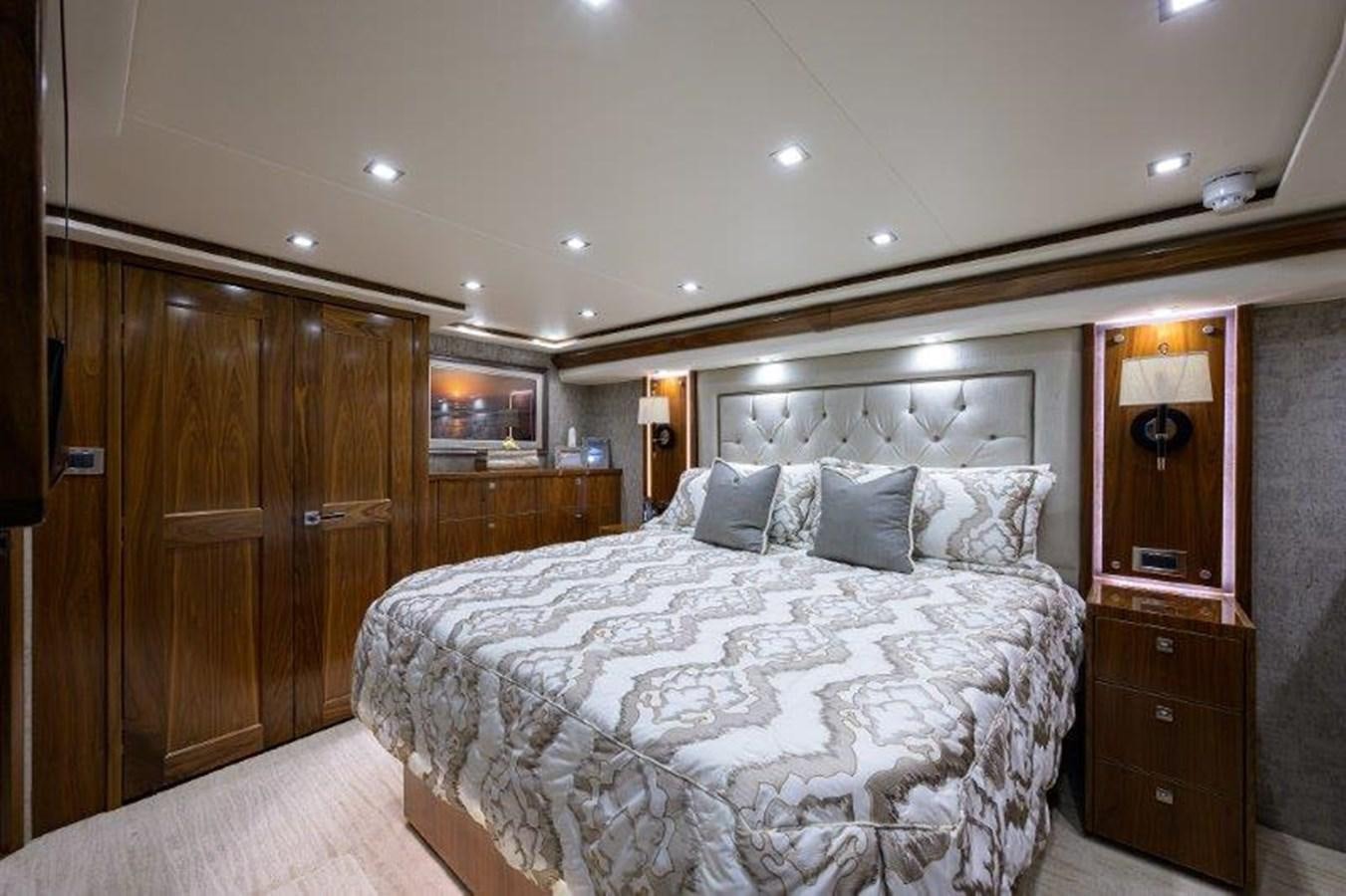 a bed in a room aboard 50 CALIBER Yacht for Sale