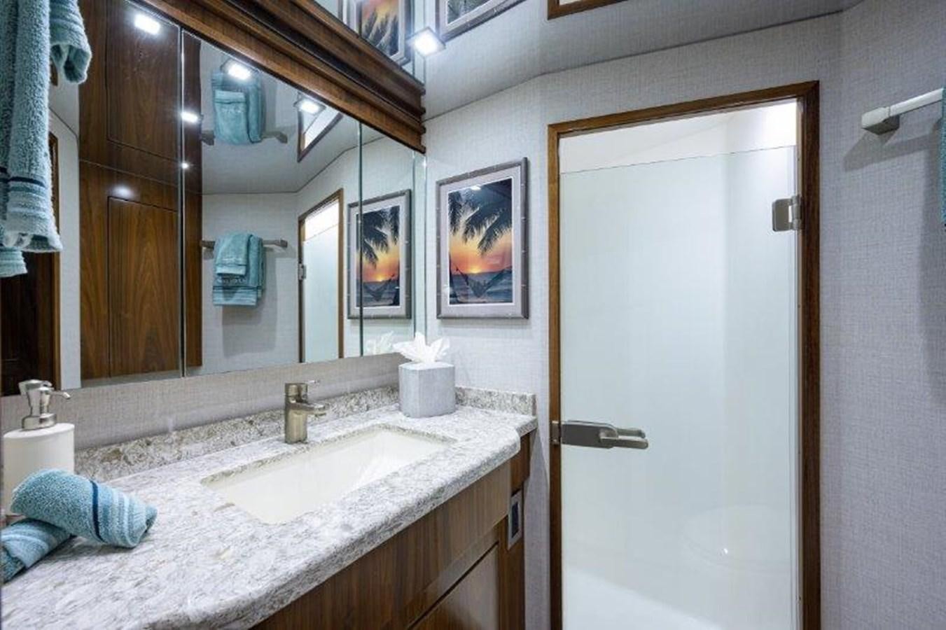a bathroom with a large mirror aboard 50 CALIBER Yacht for Sale