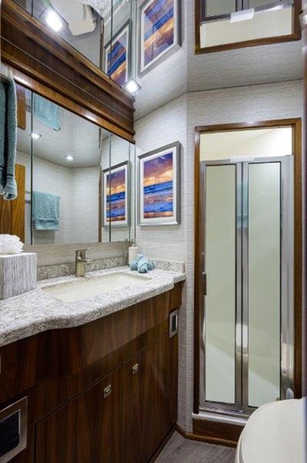 a bathroom with a large mirror aboard 50 CALIBER Yacht for Sale