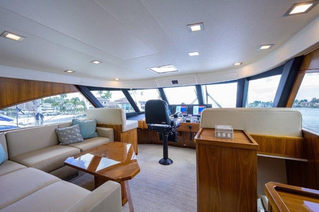 a room with a couch and a chair aboard 50 CALIBER Yacht for Sale