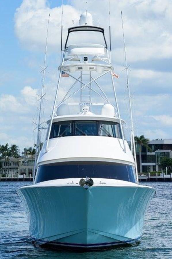 a white boat in the water aboard 50 CALIBER Yacht for Sale