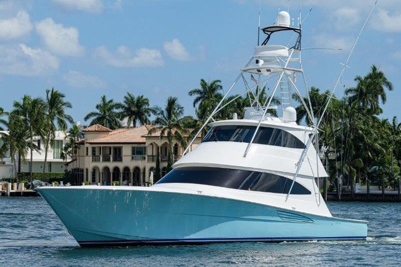 a white boat in the water aboard 50 CALIBER Yacht for Sale