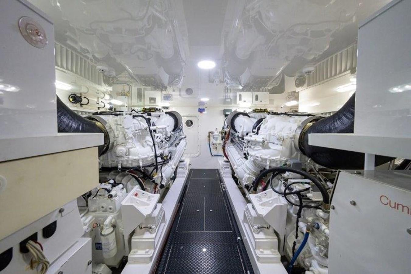 a room with a black staircase and white walls aboard 50 CALIBER Yacht for Sale
