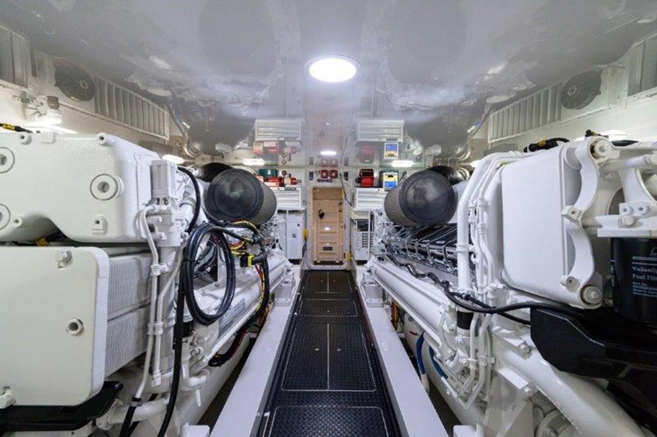 a room with white machines aboard 50 CALIBER Yacht for Sale