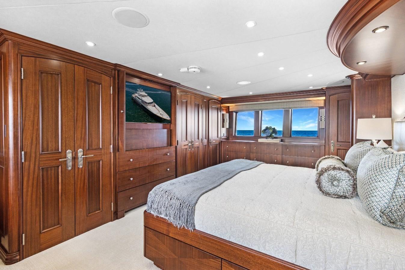 a bedroom with a large bed aboard GITANA Yacht for Charter